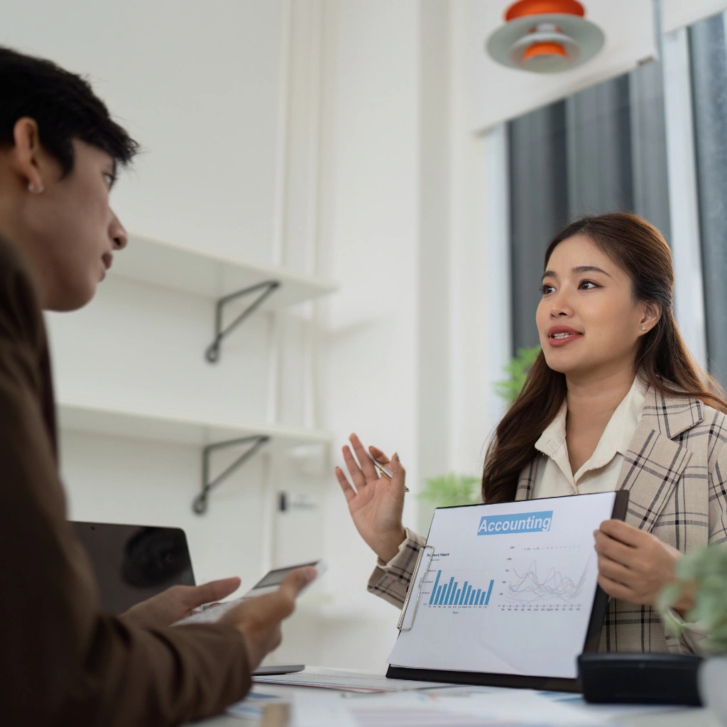 Financial adviser discussing client accounting data