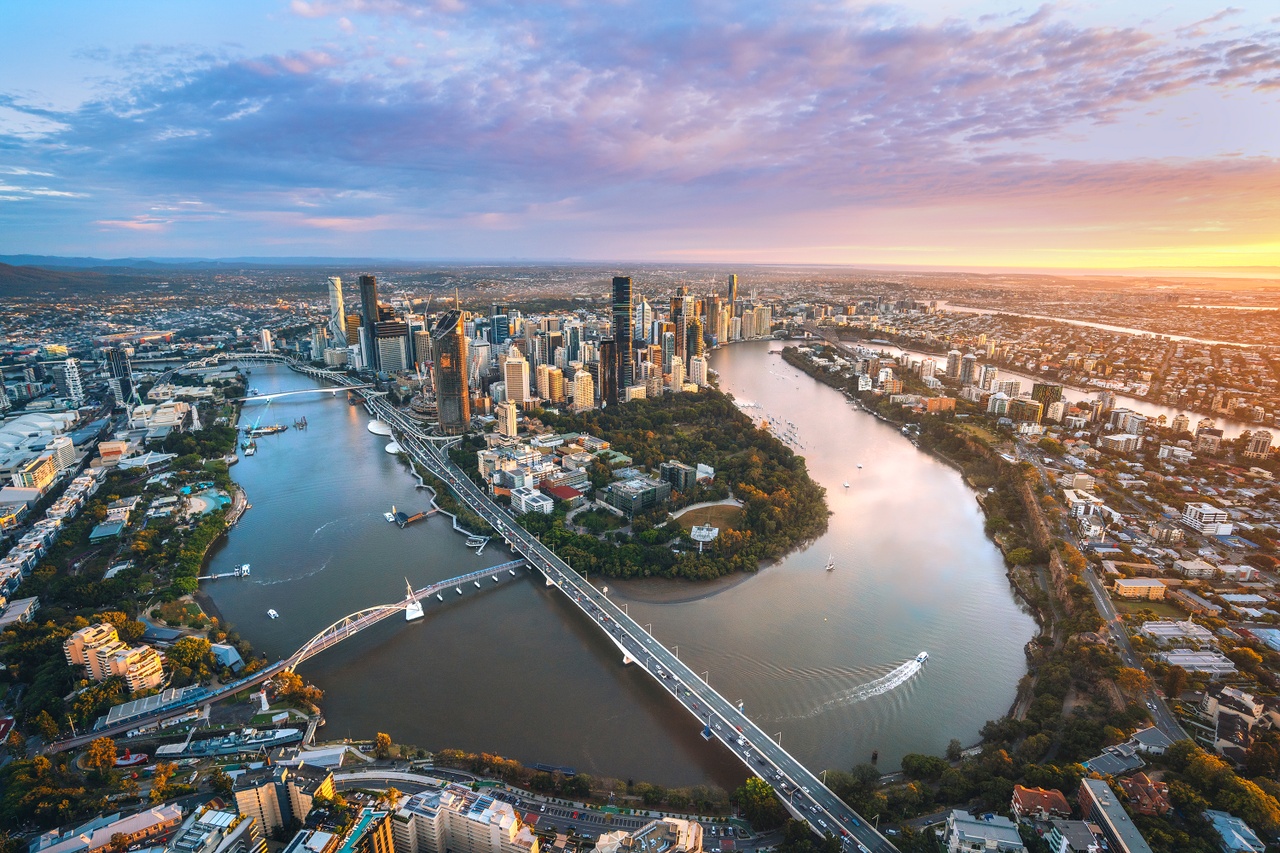 Brisbane city skyline and river at sunset