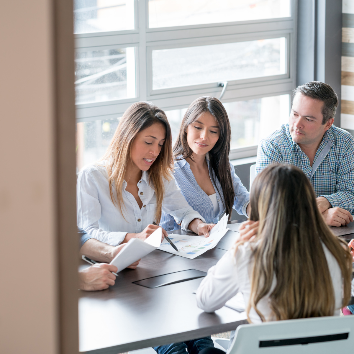 Not-for-profit board meeting with technology governance discussion