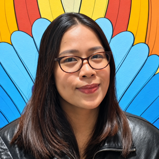 Joy Lapena, Sales Administration Assistant at All IT Services, wearing a blue striped shirt against a plain wall